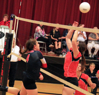 Shayla VonBargen gets a spike past Troys 511 Abbie Blum.