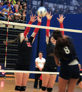 Angela Wemhoff and Shayla VonBargen go for a block against Lapwais Taylor Whitney at District.