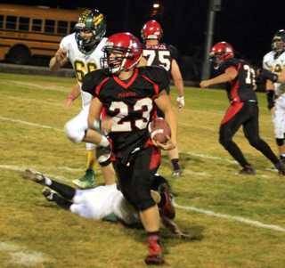 Calvin Hinkelman breaks free and wound up with a 52 yard touchdown run on this play. Also shown are Philip Spencer, 75, and Hunter Hasselstrom.