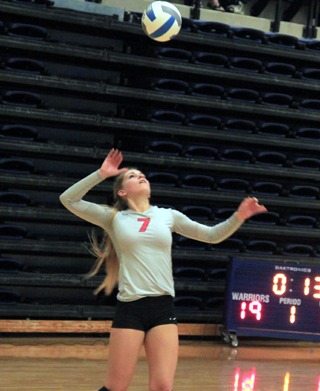 Chaye Uptmor serves against Lapwai at District.