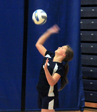 Taylor Lustig serves at District.