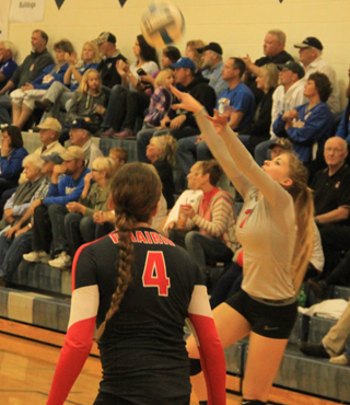 Chaye Uptmor passes the ball against Butte County. Also shown is Shayla VonBargen.