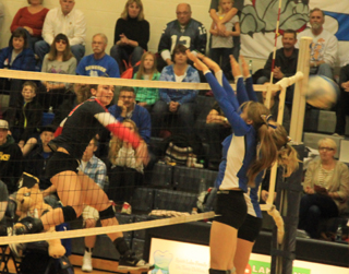 Krystin Uhlenkott scores a kill against Genesee in the semifinal.