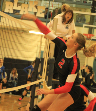 Mykaela McWilliams spikes the ball against Oakley.