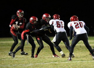 Spencer Schumacher looks to pass as the JV players played the entire second half against Wallace. Photo by Kellie Bruner.