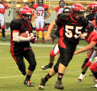 Bobby Hood lead blocks for Terran Peery on a running play.