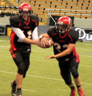 Jake Bruner appears to handoff to Calvin Hinkelman but once he saw the defensive reaction he pulled the ball back and ran it himself for a gain.