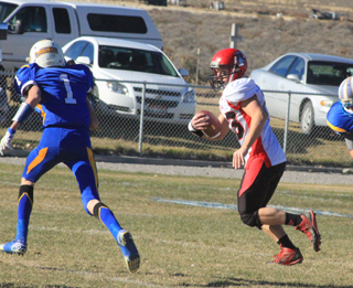 Calvin Hinkelman tries to evade a Raft River defender on this first quarter run.