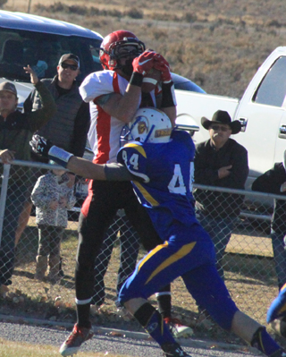 Isaiah Shears gets hit as he catches the ball but still gained 28 yards.