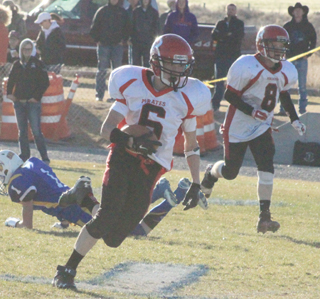 Luke Wemhoff returns one of his 3 interceptions. Also shown is Devin Bruegeman.