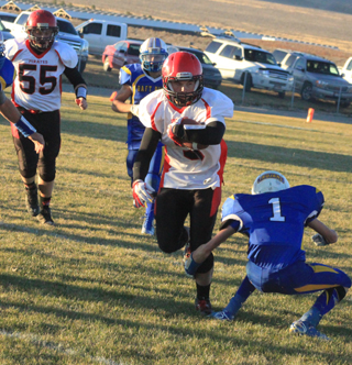 This run by Terran Peery gained a first down that enabled Prairie to run out the clock. At left is Bobby Hood.
