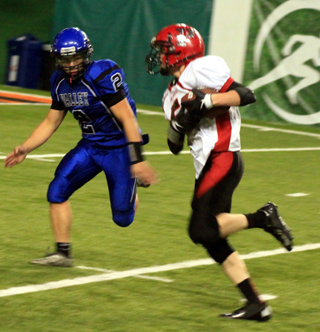 Brandon Higgins gains big yardage with a catch that set up a second half TD for the Pirates.