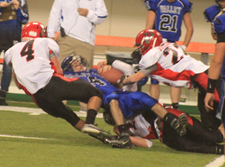 Isaiah Shears and Brandon Anderson combine on a tackle for a loss. We believe that is Calvin Hinkelman underneath the Valley player.