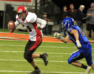 Jake Bruner rolls out and looks to pass downfield.