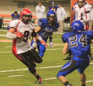 Terran Peery attempts to put a move on a defender on a running play.