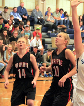 Leah Higgins and Talyss Lustig watch to see if a shot falls in and get ready for a possible rebound.