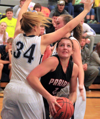 Shayla VonBargen manages to work her way between two Grangeville defenders for a shot.