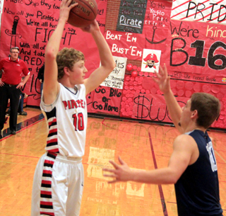 Brandon Higgins looks to pass in the Grangeville game. You can see coach Teel Bruner stalking the sideline at left.