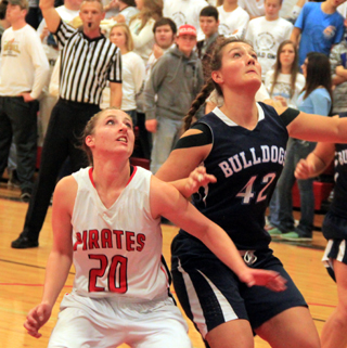 Hailey Danly and a Grangeville player battle for rebounding position.