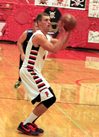 Isaiah Shears lines up a 3-point shot. It was his first varsity game action since the 2014 state tournament as he missed all of last year with a knee injury.