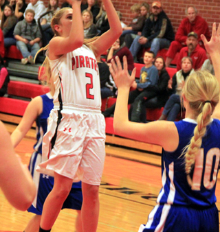 Kylie Tidwell puts up a shot in the lane against Genesee.