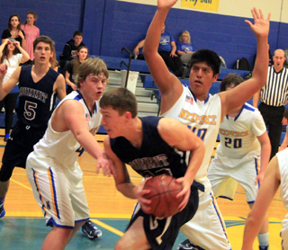 Patrick Chmelik gets fouled as he goes for a lay-up. Also shown is Dean Stubbers.