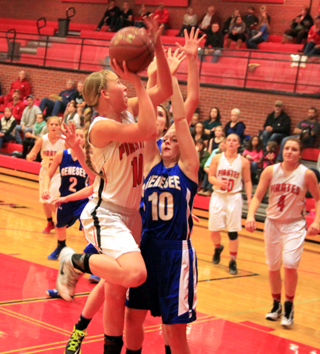 Talyss Lustig puts up a shot from the low block against Genesee. Also shown from left are Kylie Tidwell, Hailey Danly and Shayla VonBargen.