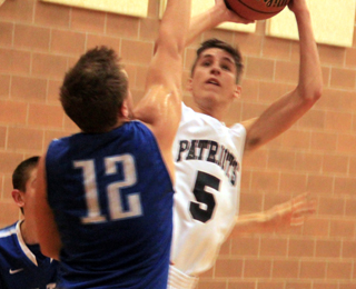 Summits Dean Stubbers puts up a shot against Colton.