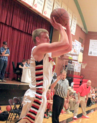 Jake Bruner puts up a shot from the outside against Asotin.