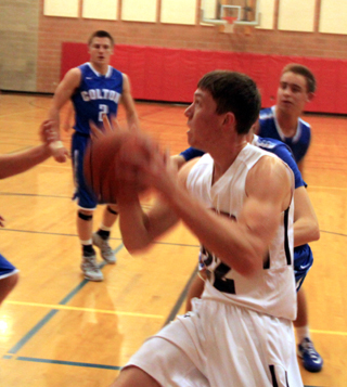 Patrick Chmelik goes for a lay-up against Colton.