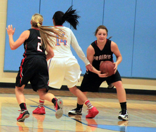 Shayla VonBargen has just taken the ball away from Lapwai's #14. Also shown is Kylie Tidwell.