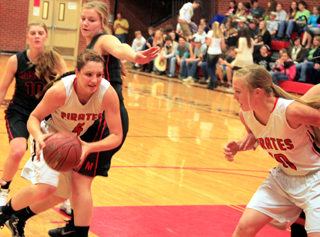 Shayla VonBargen works past a Moscow defender as Talyss Lustig sets a pick.