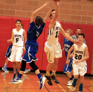 Summits Tyler Krogh knocks the ball loose from a Colton player. Also shown are Dean Stubbers, 5, and Dylan Krogh., 20.