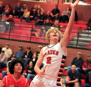 Tyson Schlader scores on a lay-up against Asotin.