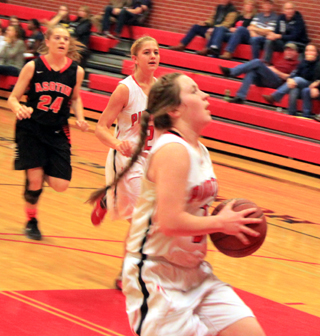 Angela Wemhoff pulls up for a lay-up after a steal against Asotin. Kylie Tidwell trails on the play.