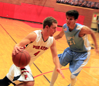 Isaiah Shears drives toward the hoop in the Lapwai game.