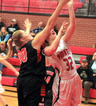 Josie Peery gets fouled as she goes for a basket.
