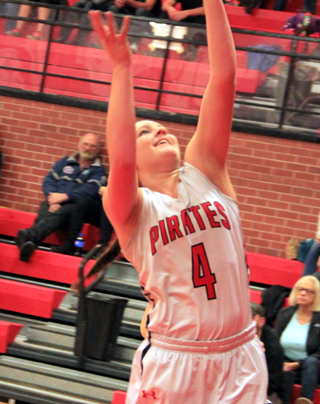 Shayla VonBargen has a big smile as she scores a layup after stealing the ball and driving the length of the floor against Asotin.
