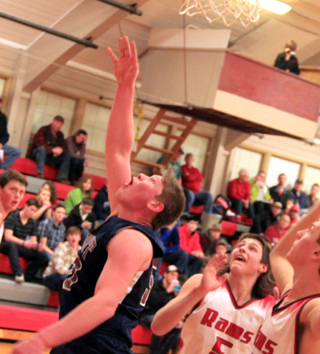 Summits Chris Osborne tries to get a shot to go in.