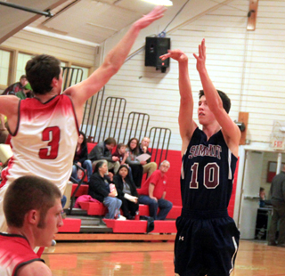 Tyler Krogh gets a shot up over the outstretched hand of C.V.s 67 Grant Wallace.