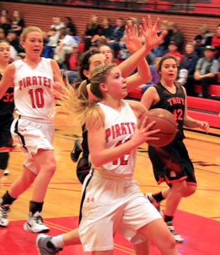Chaye Uptmor goes for a transition layup as Talyss Lustig trails on the play in the Troy game.