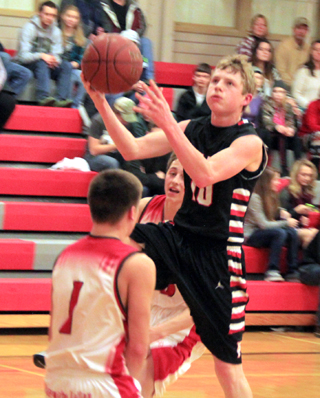Brandon Higgins managed to avoid drawing an offensive foul as he goes for a lay-up at C.V.