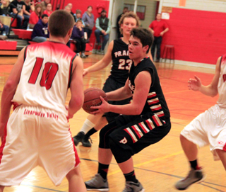 Terran Peery with the ball and Calvin Hinkelman in the boys game at C.V.