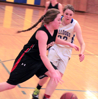 Angela Wemhoff drives past a Genesee defender.