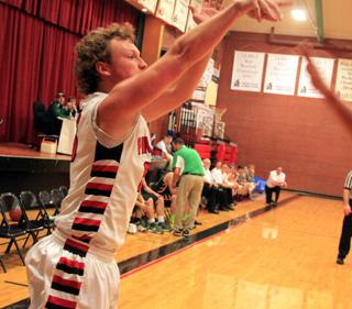 Calvin Hinkelman sinks a 3-pointer against Potlatch.