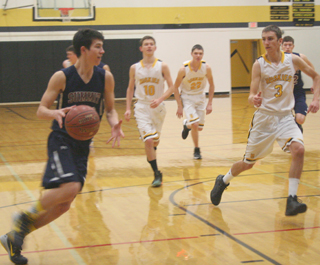 Tyler Krogh runs the break at Highland. In the background at right is Patrick Chmelik.