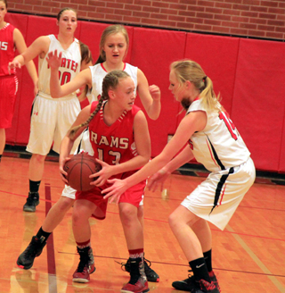 Its a double-Higgins defense on a C.V. player Monday as Jordyn Higgins and Leah Higgins play defense. In the background is Hailey Danly.