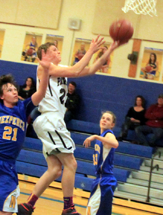 Summits Jake Stubbers goes for a layup at Nezperce.