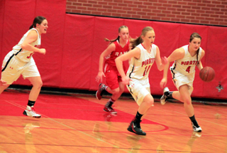 Shayla VonBargen heads upcourt after making a steal. Leah Higgins, middle, wound up scoring on the other end. Also shown is Sydney Bruner.