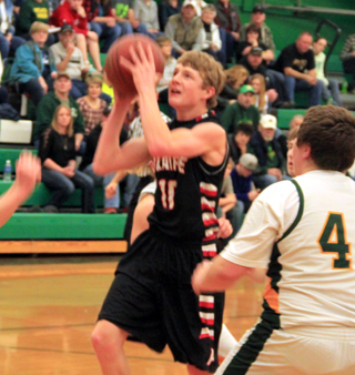 Brandon Higgins goes for a layup at Potlatch.